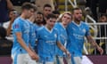 Phil Foden  celebrates after with teammates scoring their third goal .