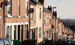 Satellite dishes on sides of terraced houses.