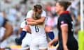 Alex Matthews and Maud Muir of England celebrate winning the Rugby World Cup 2021 semifinal against Canada at Eden Park on November 5, 2022, in Auckland.