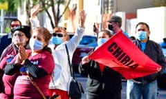 US-IMMIGRATION-PROTEST<br>Activists gesture while listening to speeches at an immigration campaign rally in Los Angeles, California on December 15, 2020. - More than 40 organizations launched a legalization and justice campaign in an effort to push the incoming Biden-Harris administration as well as Congressional leaders to pass and enact a humane immigration reform bill in the next two years. (Photo by Frederic J. BROWN / AFP) (Photo by FREDERIC J. BROWN/AFP via Getty Images)