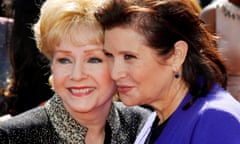 FILE PHOTO: Actress Debbie Reynolds and her daughter Carrie Fisher arrive at the 2011 Primetime Creative Arts Emmy Awards in Los Angeles<br>FILE PHOTO: Actress Debbie Reynolds (L) and her daughter Carrie Fisher (R) arrive at the 2011 Primetime Creative Arts Emmy Awards in Los Angeles September 10, 2011. REUTERS/Danny Moloshok/File Photo