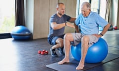 personal trainer with a senior man