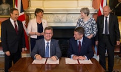 Democratic Unionist Party leader Arlene Foster and Britain's Prime Minister Theresa May pose for a photograph inside 10 Downing Street