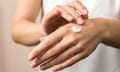skincare. close up view of woman hand moisturising them with cream. skincare.
