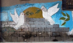 A plea for peace painted on the wall in Homs