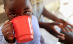 A cholera patient is rehydrated with salt and sugar solution at a clinic in Harare, Zimbabwe.