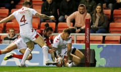 Tom Johnstone (right) scores England’s second try against France.