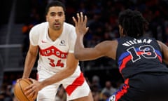 NBA: Toronto Raptors at Detroit Pistons<br>Mar 13, 2024; Detroit, Michigan, USA; Toronto Raptors center Jontay Porter (34) is defended by Detroit Pistons center James Wiseman (13) in the second half at Little Caesars Arena. Mandatory Credit: Rick Osentoski-USA TODAY Sports