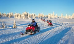 Group of snowmobiles in Lapland, near Saariselka, Finland