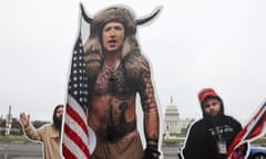 An art installation protest by the group SumOfUs portrays Twitter CEO Jack Dorsey and Facebook CEO Mark Zuckerberg as rioters from the 6 January attacks on the Capitol.