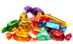 Quality Street chocolates on a white background<br>M1MKBW Quality Street chocolates on a white background