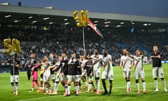 Bayer Leverkusen players celebrate in front of their fans after stretching their unbeaten run to 50 games.