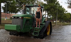 Houston Area Begins Slow Recovery From Catastrophic Harvey Storm Damage<br>KATY, TX - SEPTEMBER 04: Two girls ride through floodwaters an a tractor on September 4, 2017 in Katy, Texas. Over a week after Hurricane Harvey hit Southern Texas, residents are beginning the long process of recovering from the storm. (Photo by Justin Sullivan/Getty Images)