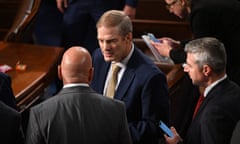 White men in suits talk to each other