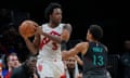 Toronto Raptors forward OG Anunoby, left, looks to pass as he is guarded by Washington Wizards guard Jordan Poole during the second half of Wednesday’s game.