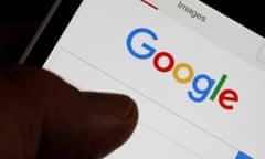 FILE PHOTO: A man holds his smartphone which displays the Google home page, in this picture illustration taken in Bordeaux, Southwestern France, August 22, 2016. REUTERS/Regis Duvignau/File Photo