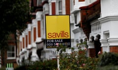 A Savills estate agent sign outside a home in south London