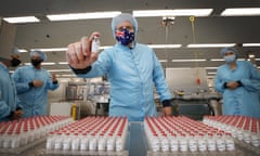 Prime minister Scott Morrison holds a vial of AstraZeneca vaccine during a visit to the CSL serum lab