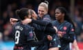 Laura Coombs (centre right), Mary Fowler (left) and Khadija Shaw (right) celebrate.