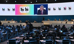Thomas Bach is seen on a digital screen as he speaks during the second day of the 141st session of the IOC Congress in Mumbai.