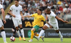 Australia’s Marco Tilio and New Zealand’s Bill Tuiloma chase the ball during the Socceroos’ second friendly with the All Whites at Eden Park.