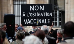 Protesters opposed to France's health pass demonstrate in Paris
