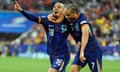 Donyell Malen celebrates with Xavi Simons after scoring the third goal against Romania