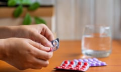 Woman taking pills or medicine