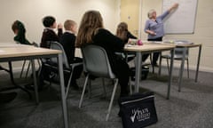 .<br>Children being coached for the 11 Plus exam. Evening classes at Kings Hill, West Malling, Kent. 13-02-2013 Photograph by Martin Godwin. 