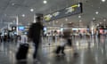 Airline passengers make their way through Melbourne Airport in Melbourne, Wednesday, Aug. 2014. The federal government has revealed that counter-terrorism units have intercepted a "person of interest" after beginning operations late last week at international airports in Sydney and Melbourne. (AAP Image/Julian Smith) NO ARCHIVING