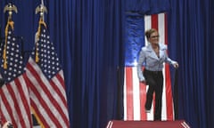 Sarah Palin enters the stage to speak during a rally at the Alaska Airlines Center on 9 July.