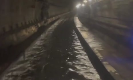 Extreme flooding in tunnel used by Eurostar halts trains – video