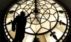 Horologist Mark Crangle repairing the Town Hall clock in Manchester.