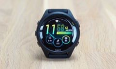 Garmin Forerunner 265 review showing the default watchface on a table.