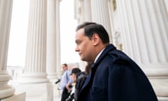 Representative George Santos leaves the Capitol after being expelled from the House, on Friday.