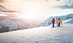 Two skiers on the slopes at Kitzbühel, Austria.