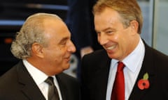 British Prime Minister Tony Blair (R) talks to Arcadia boss Sir Philip Green during a visit for the official opening of the Fashion Retail Academy in central London, 31 October 2006. Blair strutted into the fashion world Tuesday -- then revealed his attempts to cut a dash in the beachwear range proved a disaster. Blair, normally a man for a sober suit and tie combination, lifted the lid on his fashion hell as he attended the opening of the Fashion Retail Academy's new home in London. "I have to say that when I told my wife and 18-year-old daughter about coming to the opening of this fashion academy, they fell about laughing, he said. I am not known for my fashion sense."