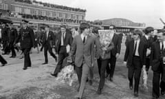 The Beatles leaving the aircraft at Liverpool airport for the northern premiere of A Hard Day's Night, 10 July 1964.