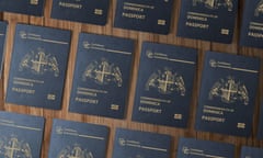 Dominica passports on a wooden table