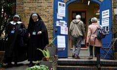 Nuns from the Tyburn Convent leave a polling station in London.