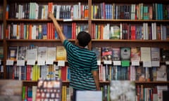 A person looking for books in a bookstore