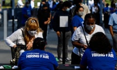 People receive information as they attend a job fair in Inglewood, California, in September.