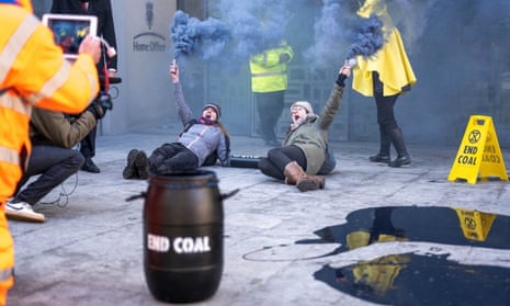 Extinction Rebellion activists spill black paint in front of Michael Gove's office – video