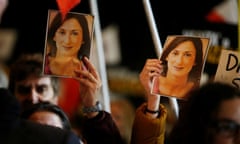 People carry pictures of the assassinated journalist Daphne Caruana Galizia at an anti-corruption protest in Valletta, Malta, on Saturday.