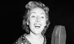 Vera Lynn singing into a microphone