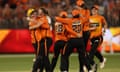 Beth Mooney and Taneale Peschel (far right) celebrate winning the Women's Big Bash League Final.