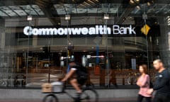 People walk by a Commonwealth Bank branch in Brisbane