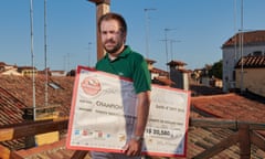 Nicolò Falcone playing Monopoly on the roof of his home in Venice, Italy.