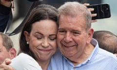 Venezuelan opposition leader Maria Corina Machado  hugs presidential candidate Edmundo González