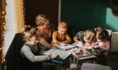 A mother homeschooling four children